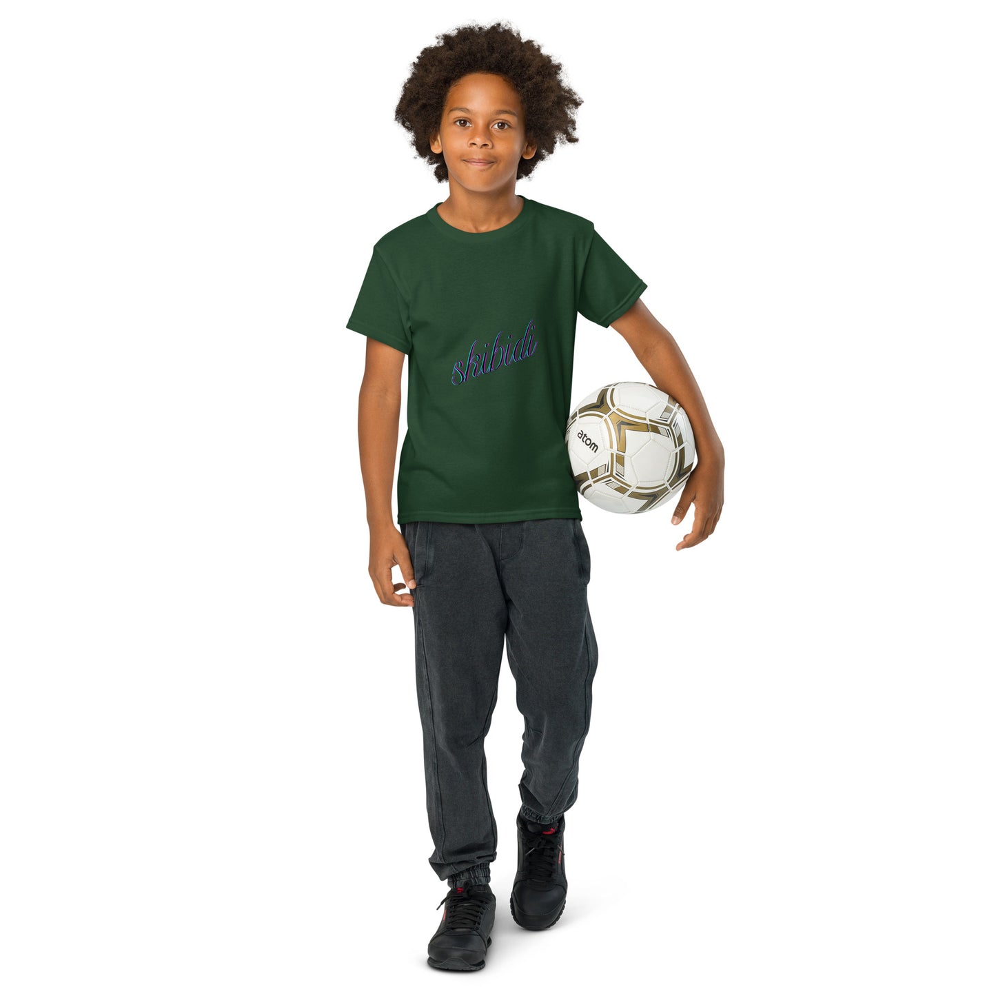 Young model with soccer ball rocking forest green "skibidi" youth tee, purple cursive front