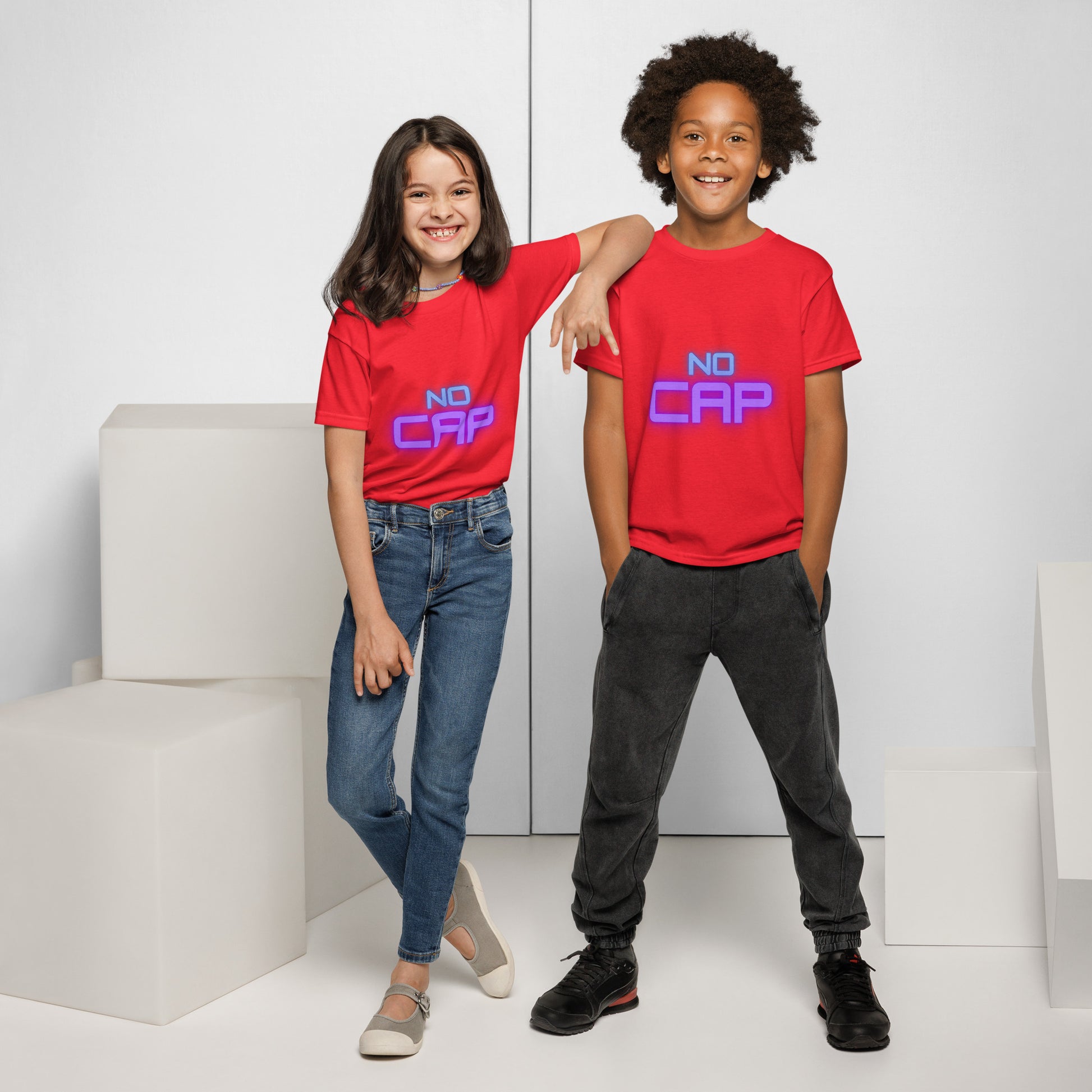 Duo kids in red "No Cap" glow tees, arm-in-arm front vibe