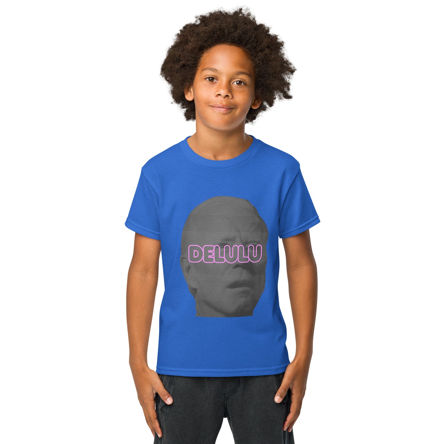Front view of kid model in royal blue Delulu youth tee, gray face silhouette with pink "DELULU" print